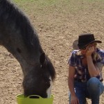 charlie eating from green bucket,with Rachel looking on.