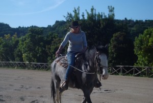 Rachel riding and guiding Charlie